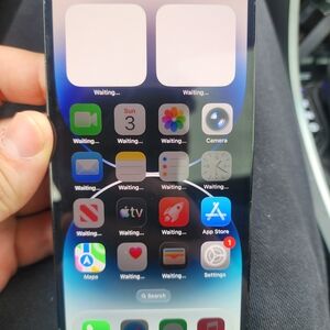 Apple iPhone with Black Front and Blue Gradient Wallpaper Screen